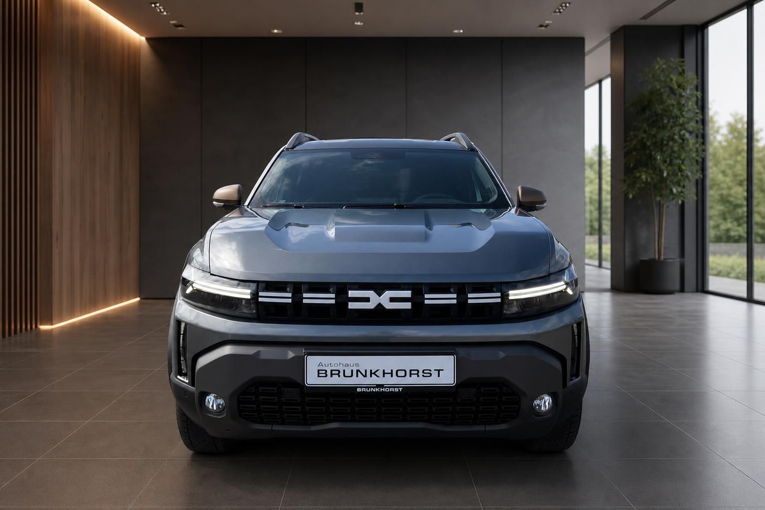 Dacia Duster Frontansicht in grau mit LED-Scheinwerfern und charakteristischem Kühlergrill
