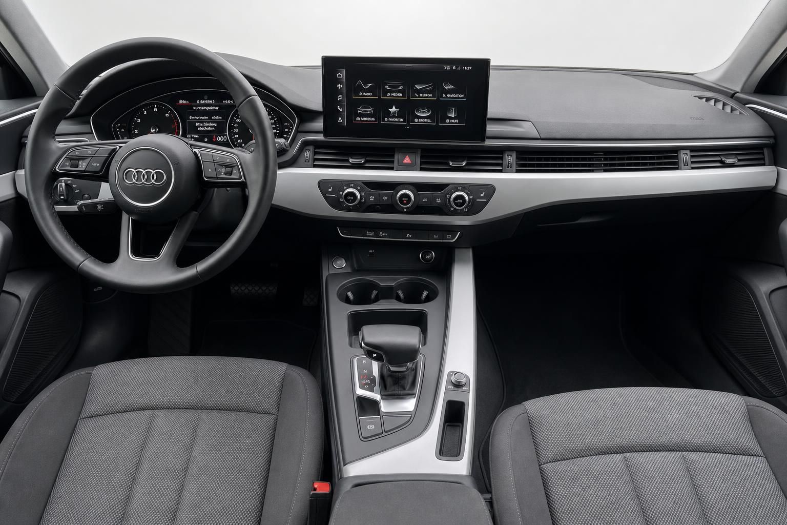 Audi A4 Innenraum mit Cockpit, Lenkrad, Infotainment und Sitzen in Grau