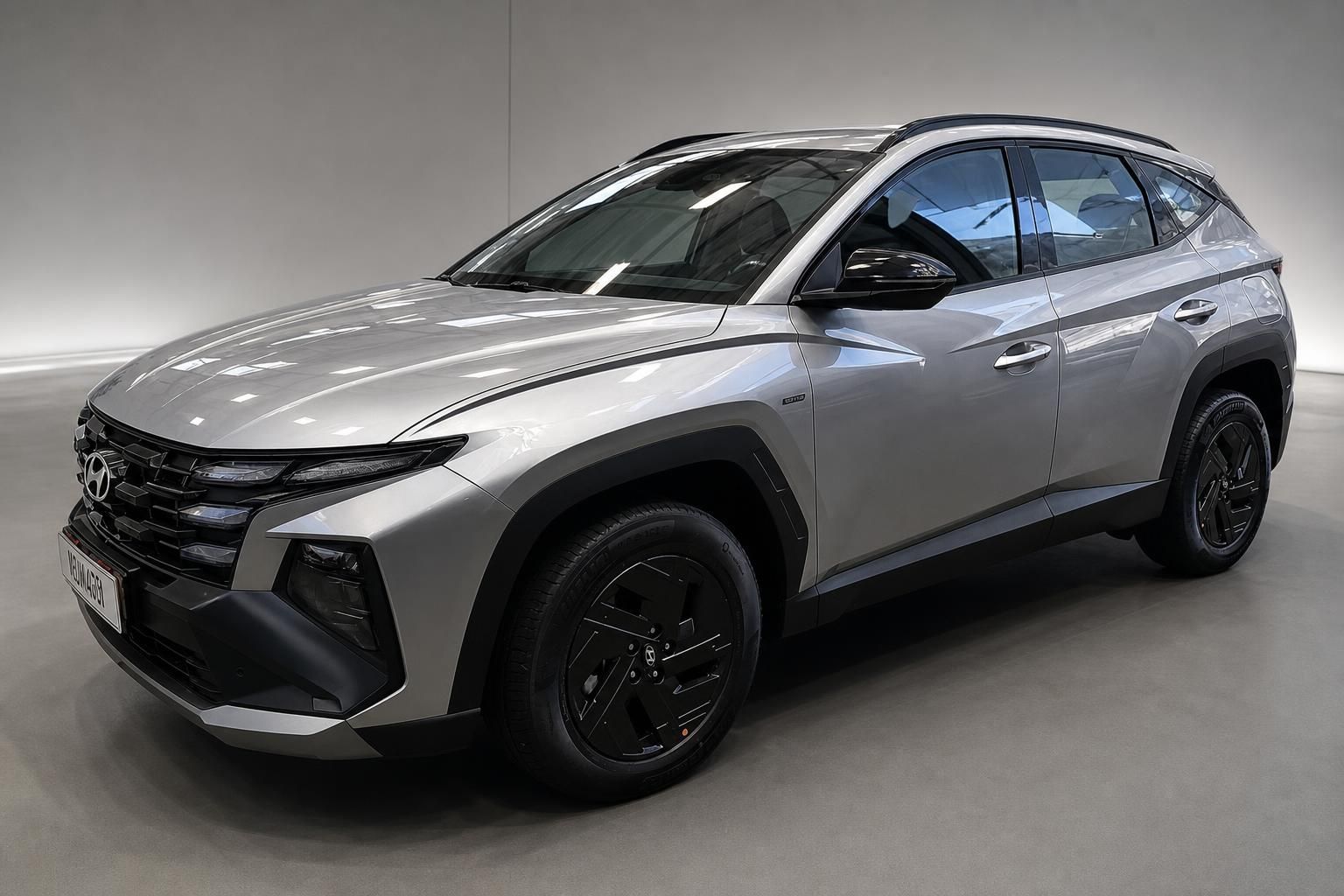 Hyundai Tucson SUV in Silber, Frontansicht schraeg
