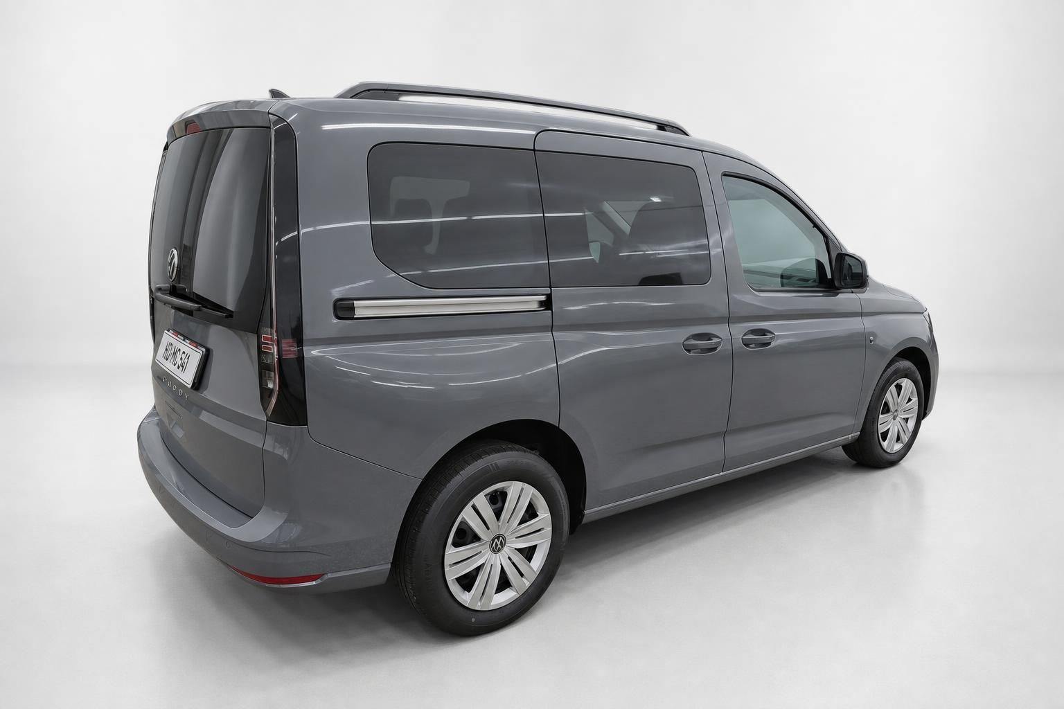 VW Caddy grau, Heck- und Seitenansicht im Fotostudio