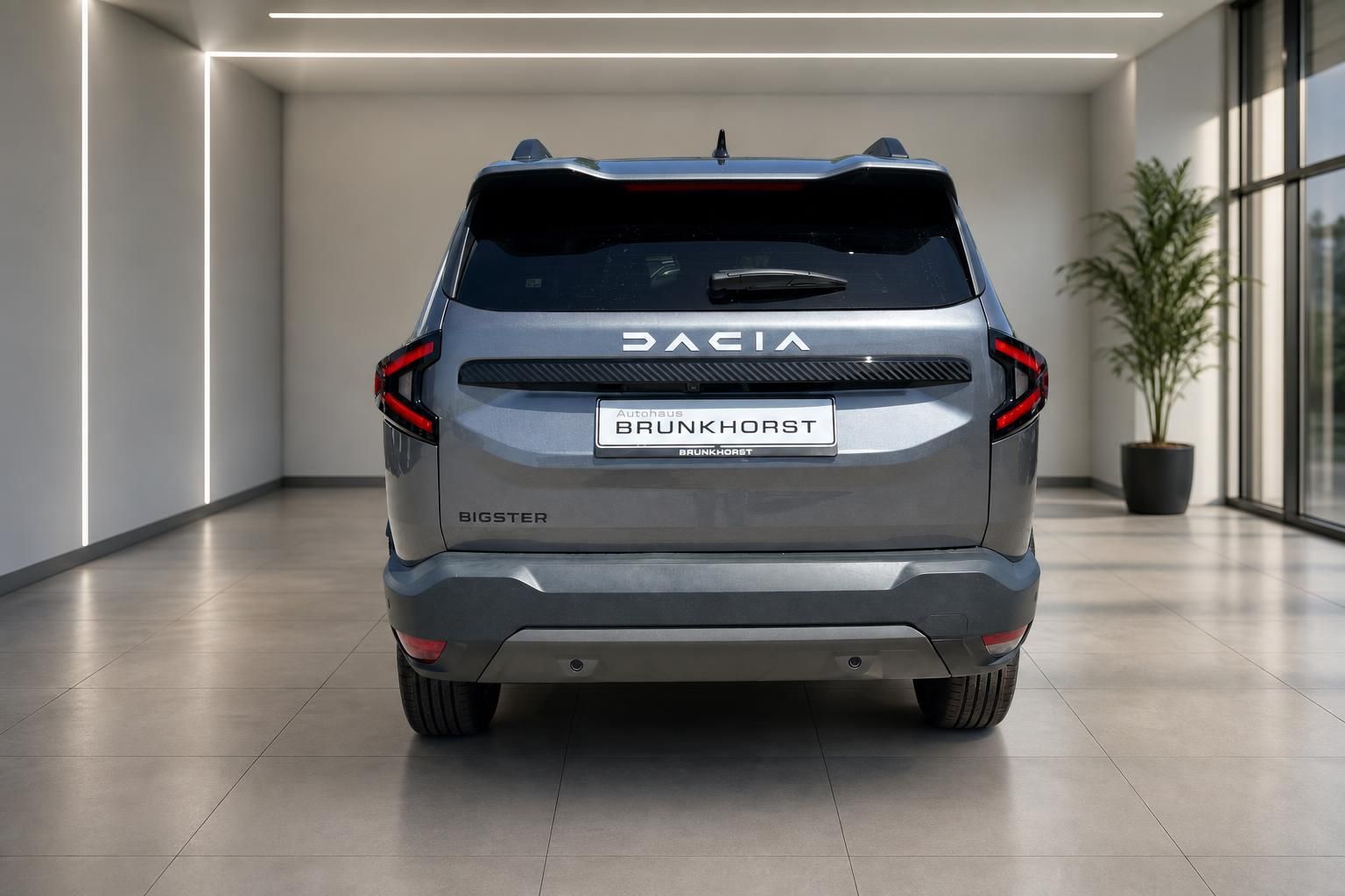 Dacia Bigster SUV in grau - Heckansicht mit Dachträger und modernem LED-Design