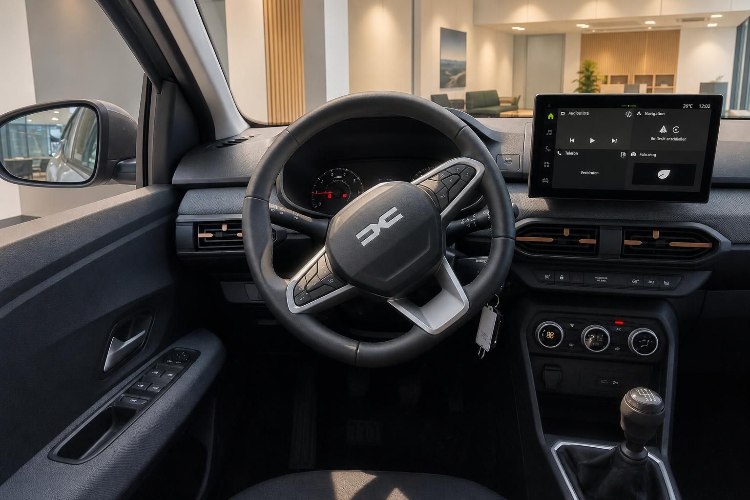 Fahrerseite mit Lenkrad und Infotainment-Display im Autoinnenraum