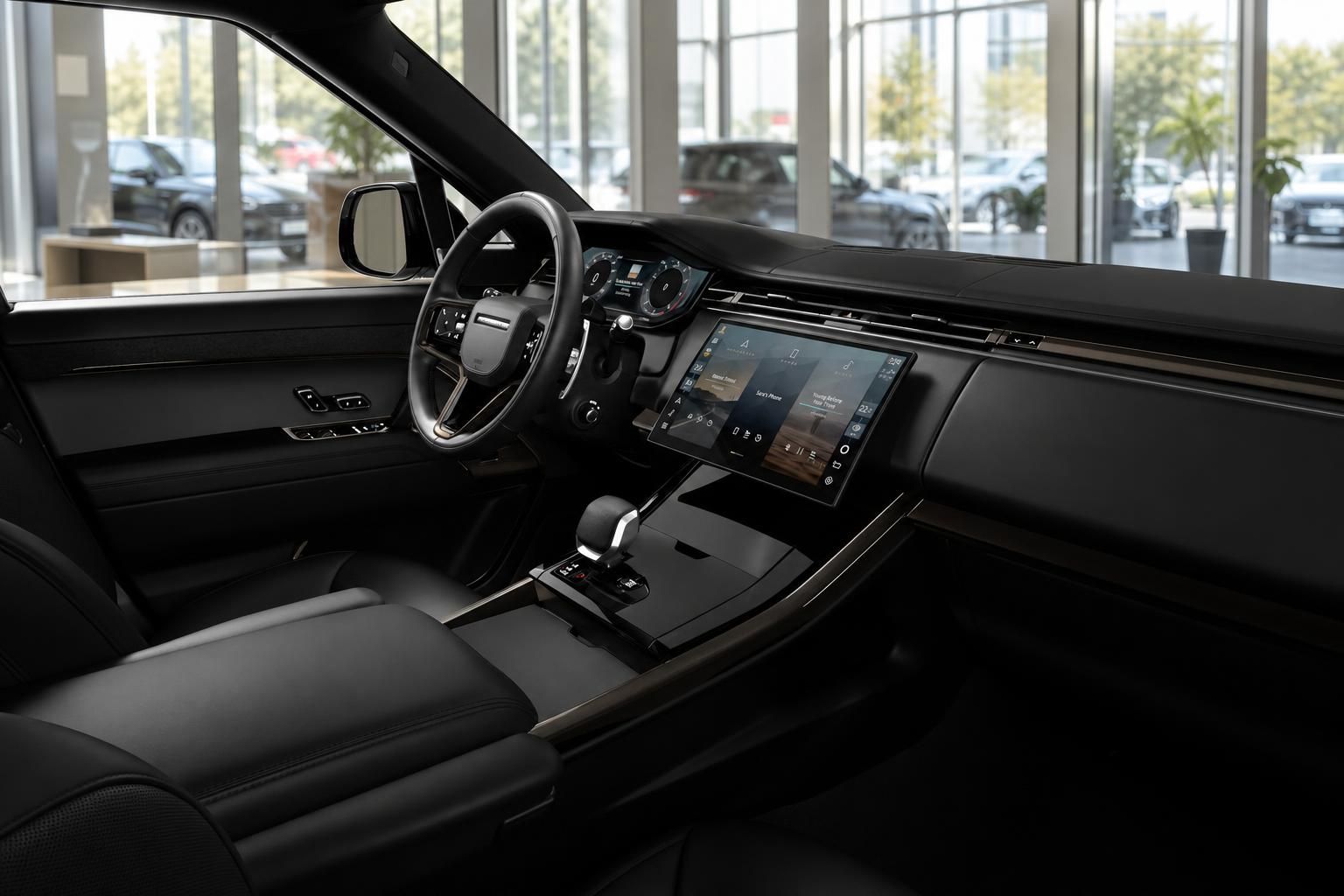 Range Rover Innenraum mit Lederausstattung und digitalem Touchscreen