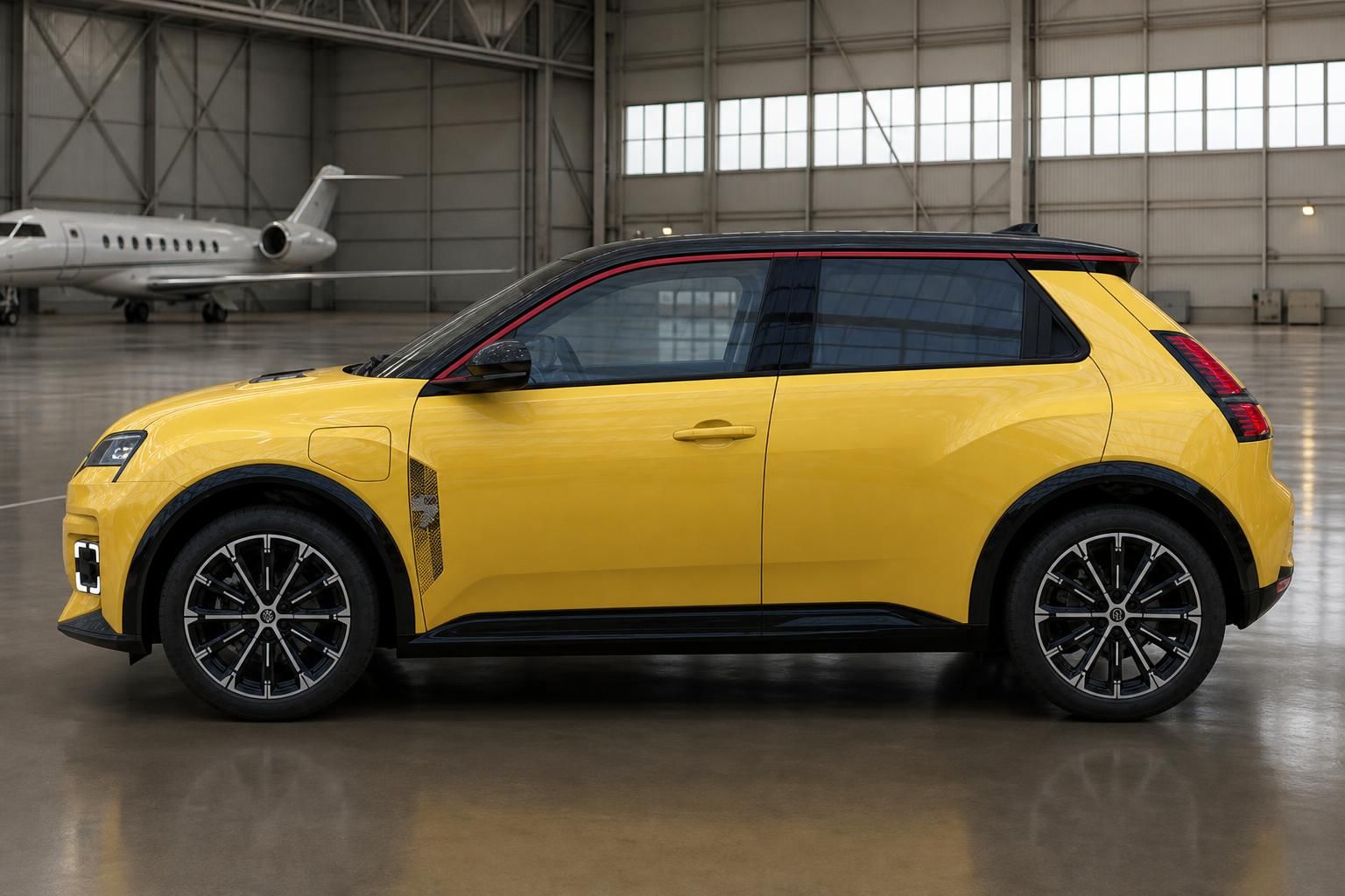 Renault 5 gelb Seitenansicht rechts mit Leichtmetallfelgen im Hangar