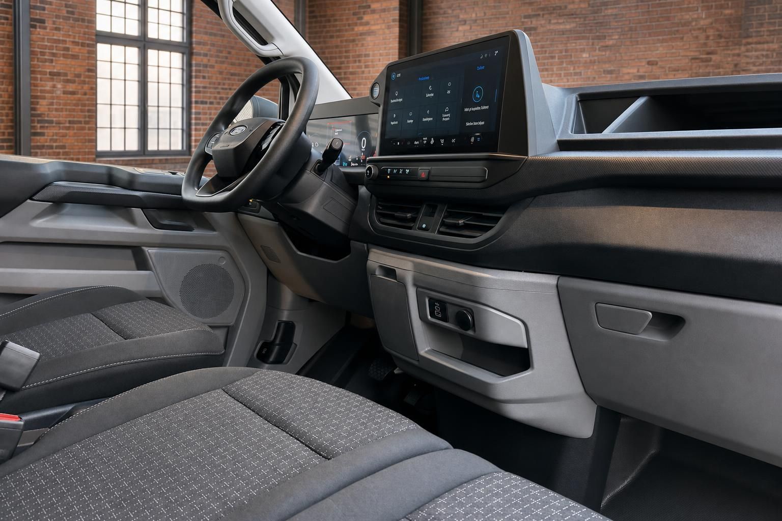 Ford Transit Custom Innenraum – Cockpit mit Touchscreen, Lenkrad und Sitze in Grau