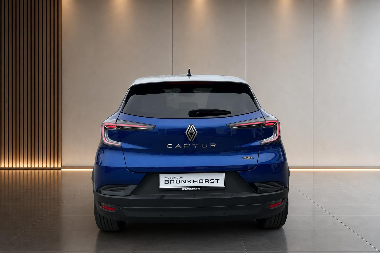 Renault Captur in Blau - Heckansicht mit CAPTUR Schriftzug und Autohaus Brunkhorst Kennzeichen