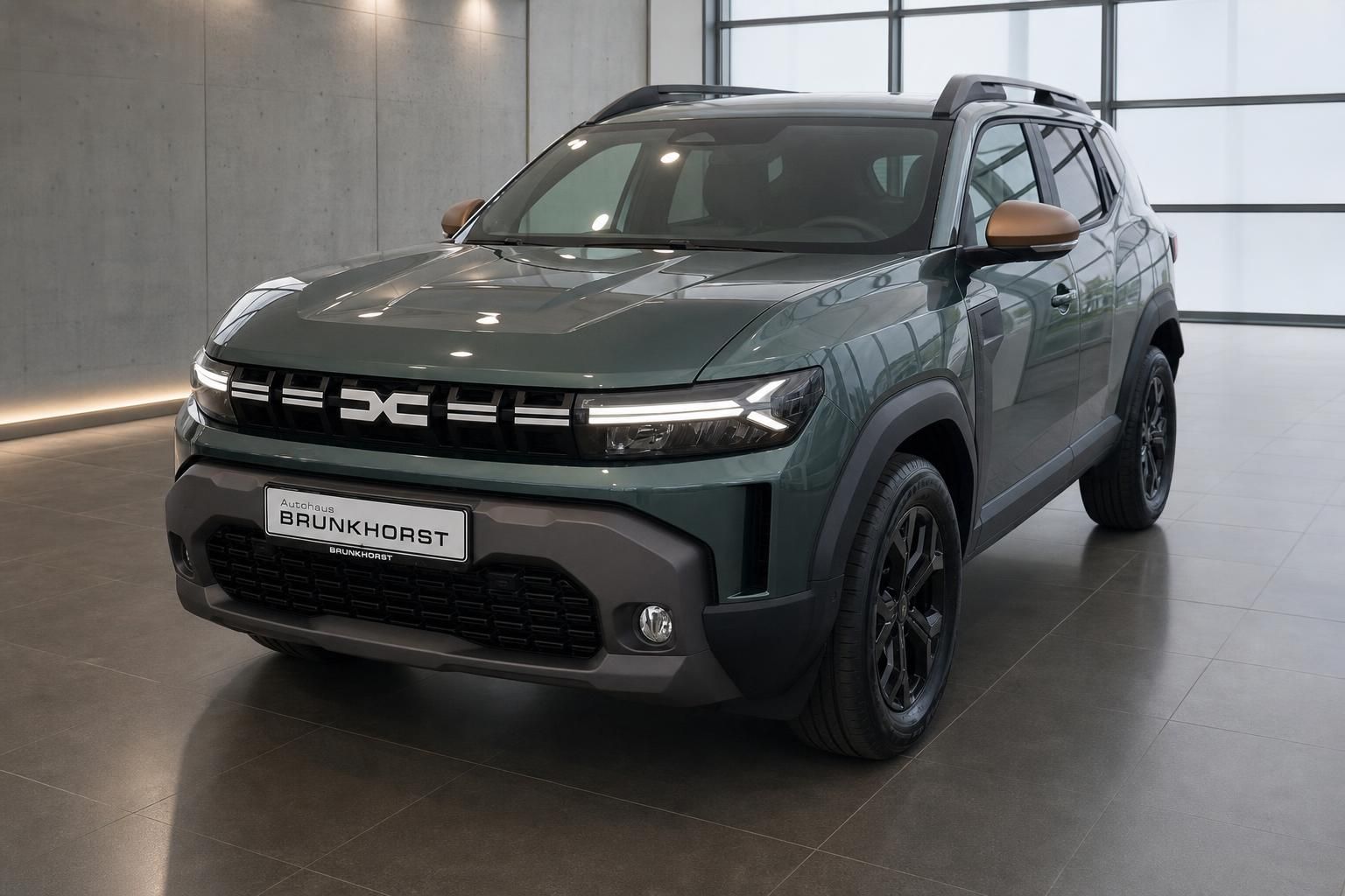 Dacia Duster grün Seitenansicht schräg vorne