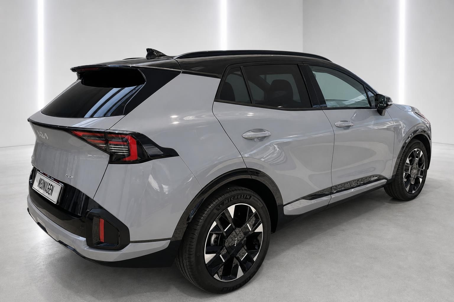 Kia Sportage GT-Line in Grau, Heckansicht seitlich