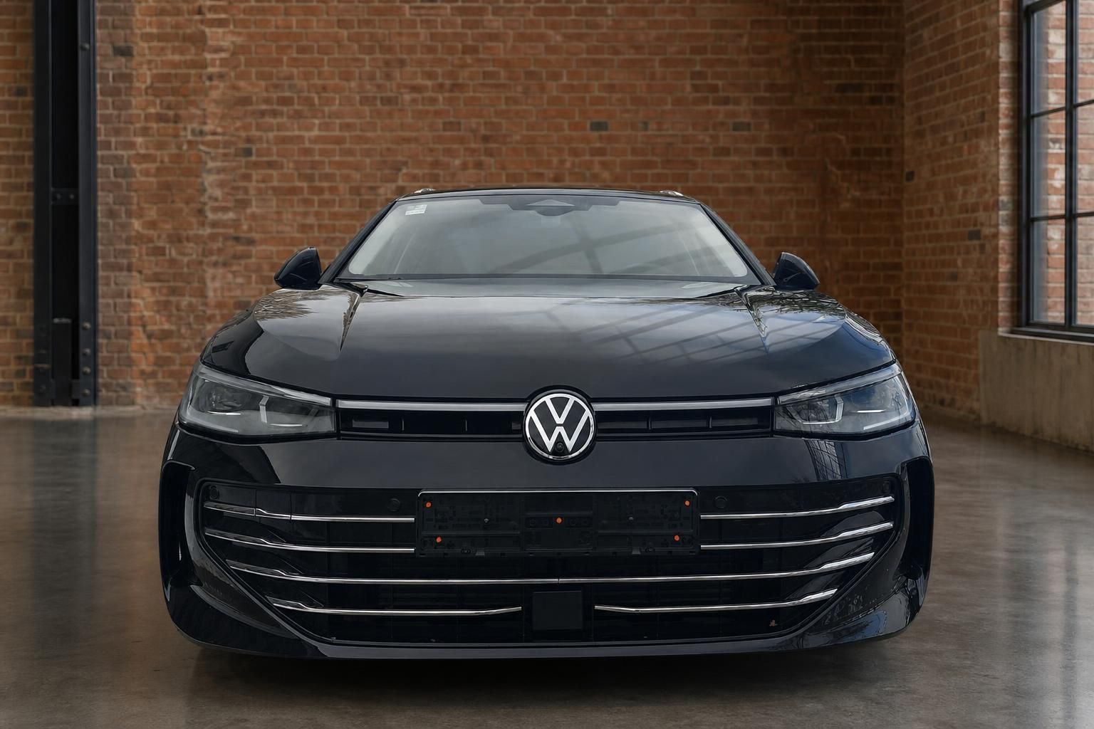 VW Passat schwarz Frontansicht mit Kühlergrill und Logo in Loft