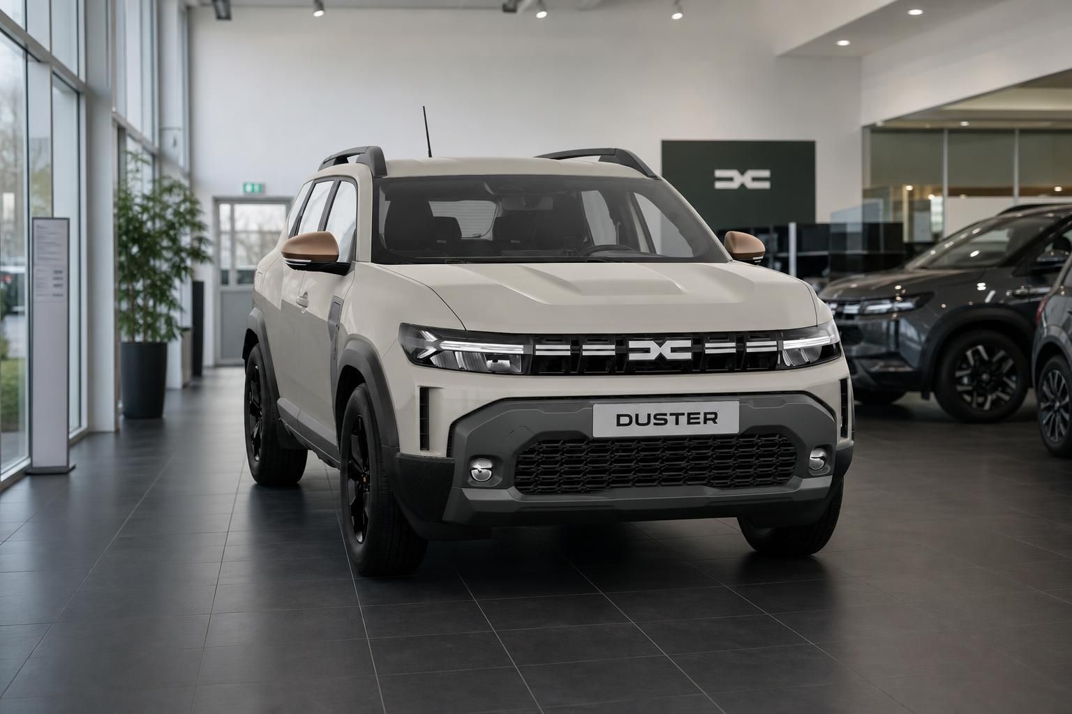 Dacia Duster beige im Showroom, Frontansicht mit Kennzeichenschild