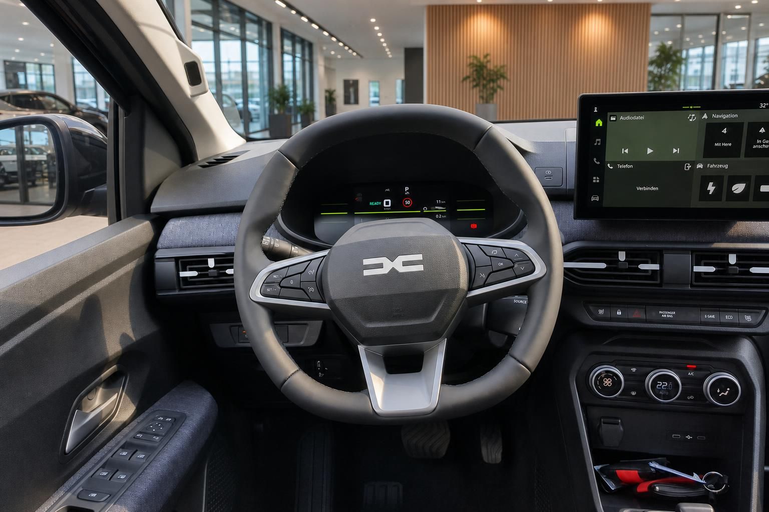 Lenkrad und Cockpit mit digitalem Display im Fahrzeug