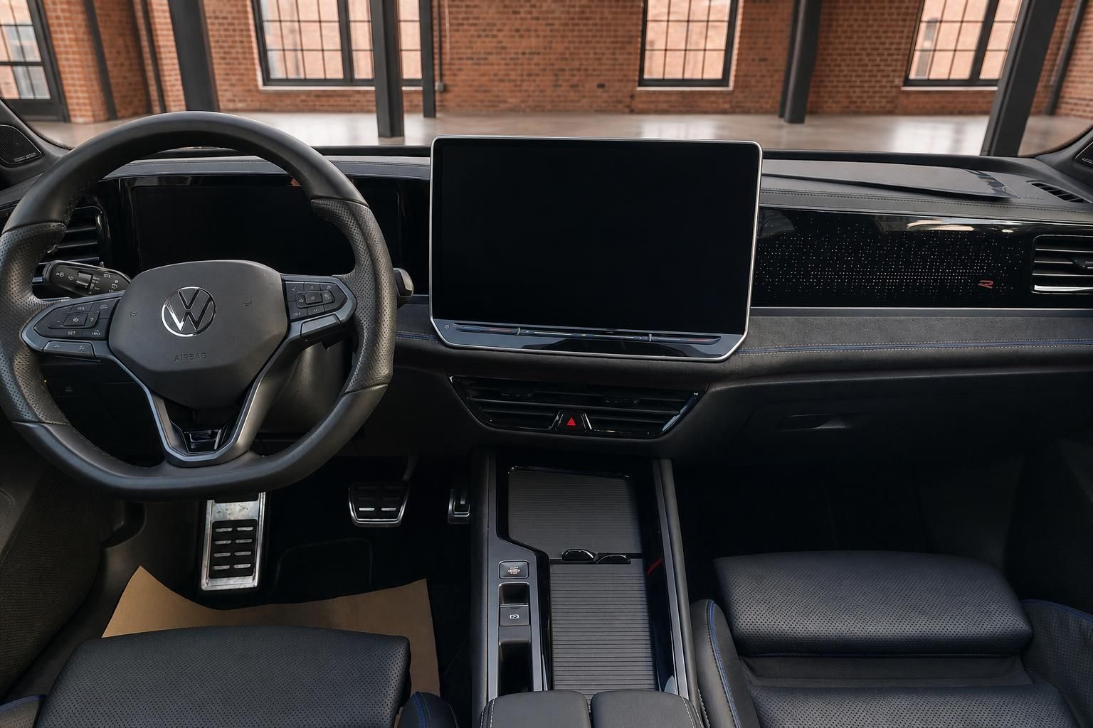 VW Cockpit Übersicht mit Lenkrad, Touchscreen und Vordersitzen