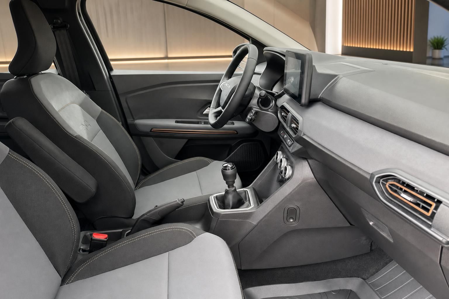 Dacia Fahrzeug Innenraum Beifahrerseite mit grauer Ausstattung und Mittelkonsole