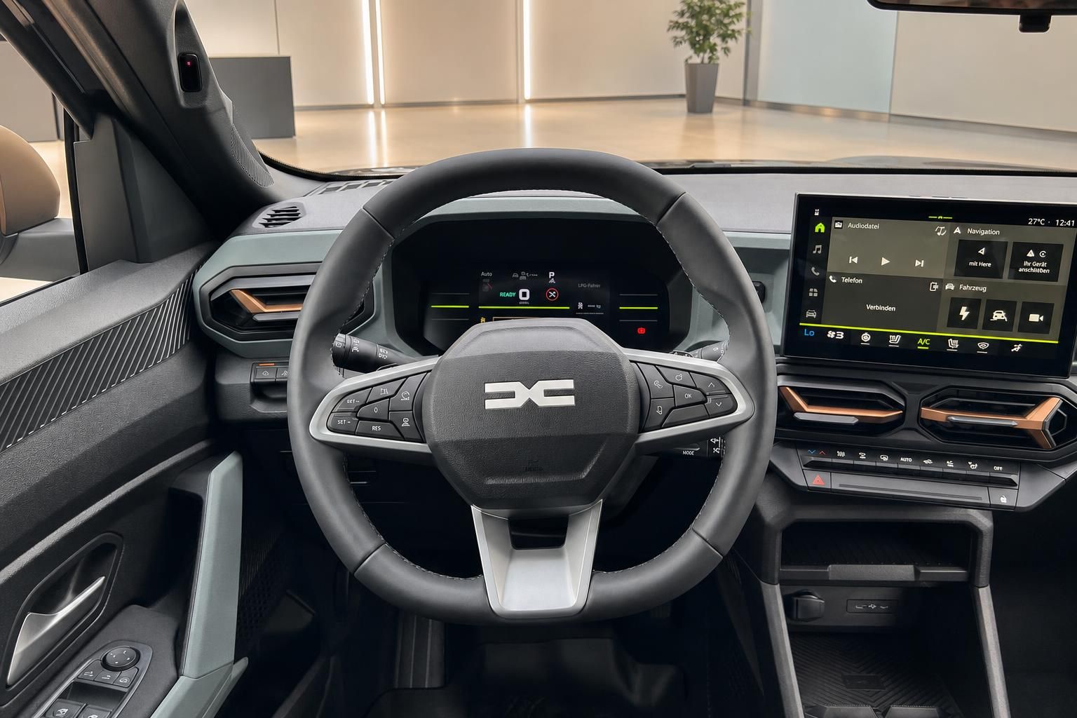 Cockpit mit Lenkrad und Multimedia-Display im Fahrzeuginnenraum