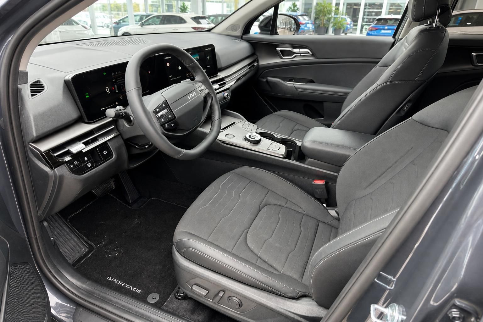 Kia Sportage Fahrersitz und Cockpit mit Lenkrad im Detail