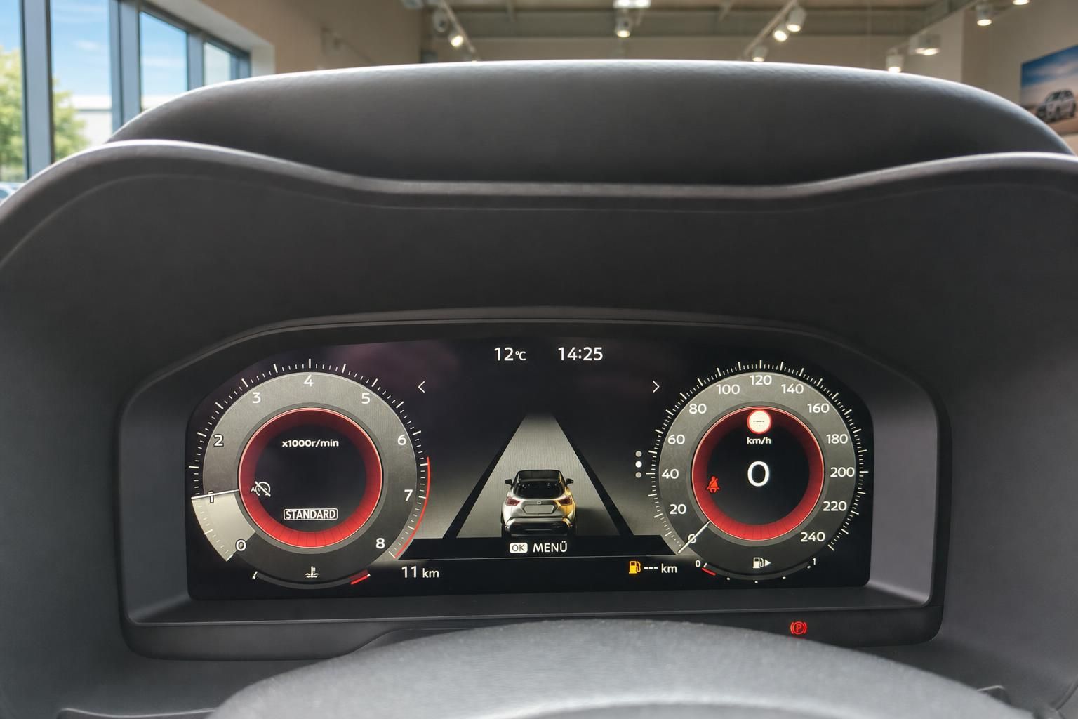 Digitales Armaturenbrett mit Tachometer und Drehzahlmesser in modernem Fahrzeug-Cockpit