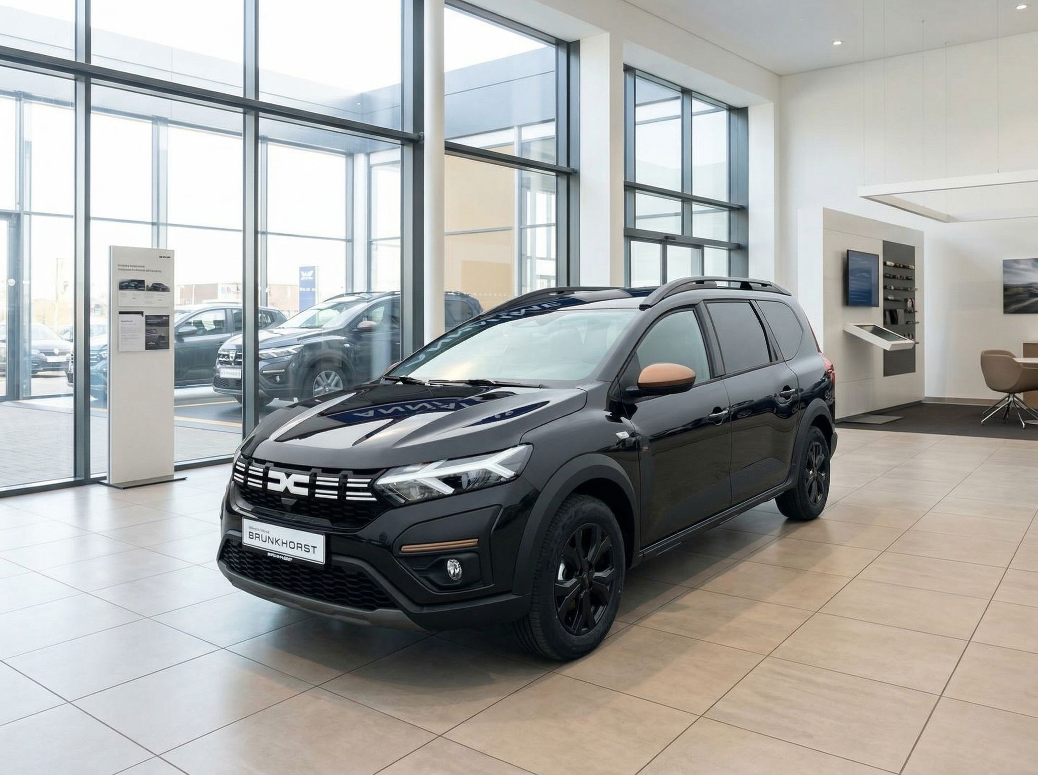 Dacia Jogger in grau im Autohaus Brunkhörst Showroom - Seitenansicht