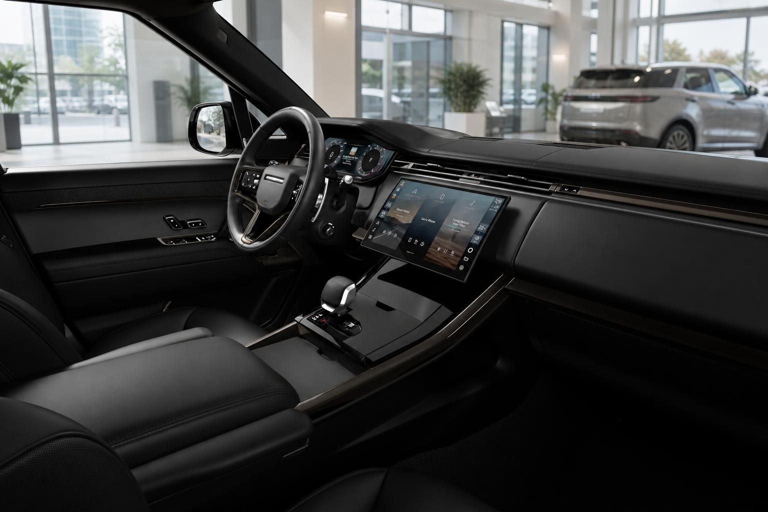 Range Rover Innenraum mit Lederausstattung und Touchscreen-Cockpit