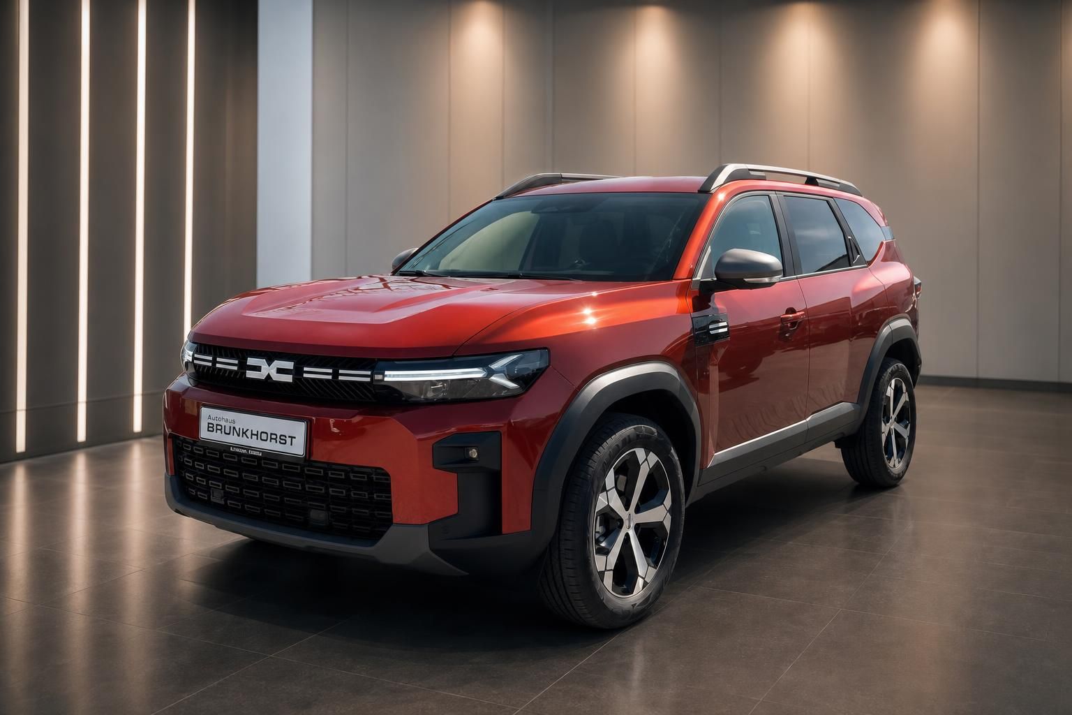 Dacia Bigster SUV in rot, Seitenansicht im Autohaus Brunkhorst Showroom