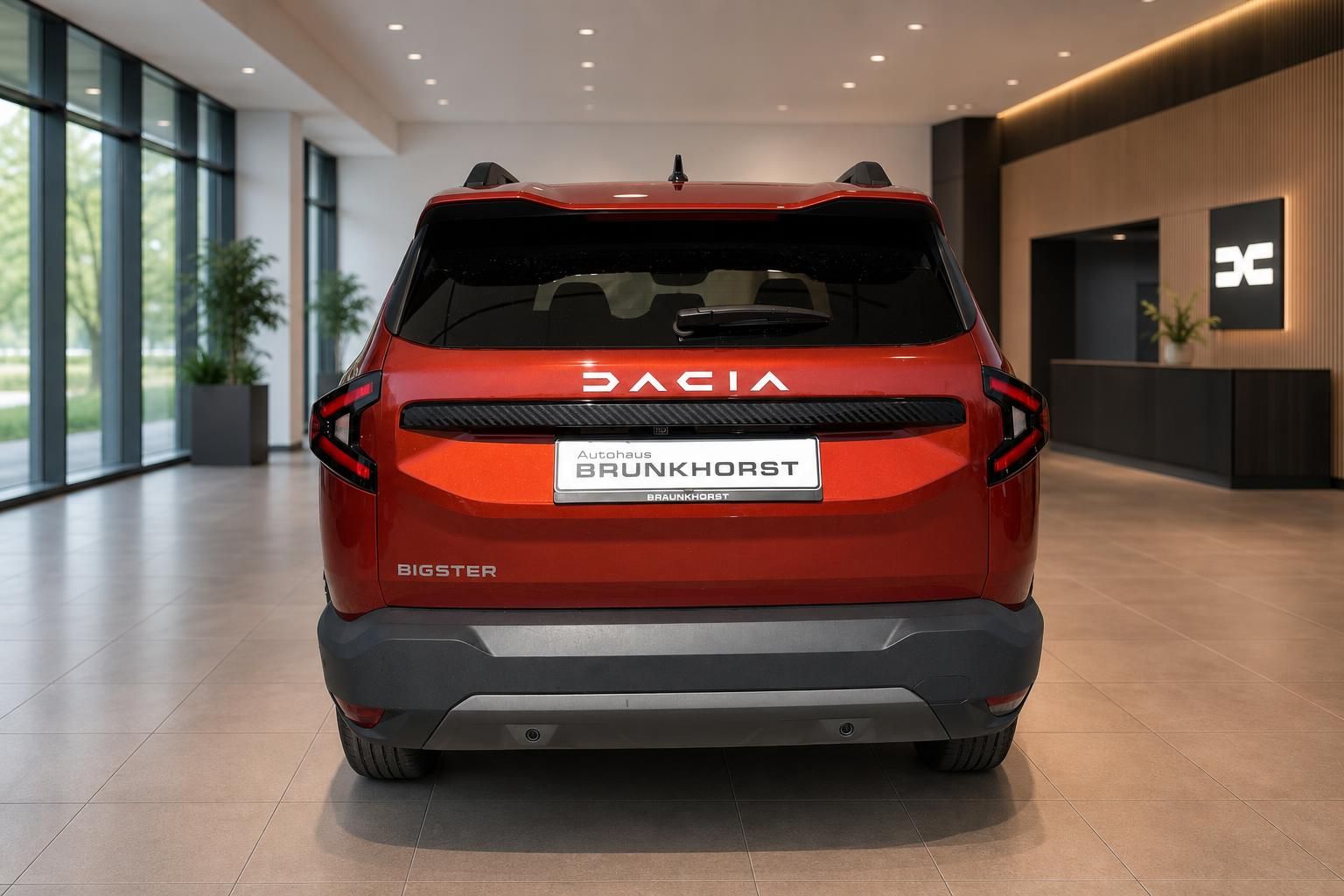 Dacia Bigster Heckansicht in rot mit Autohaus Brunkhorst Kennzeichen im Showroom