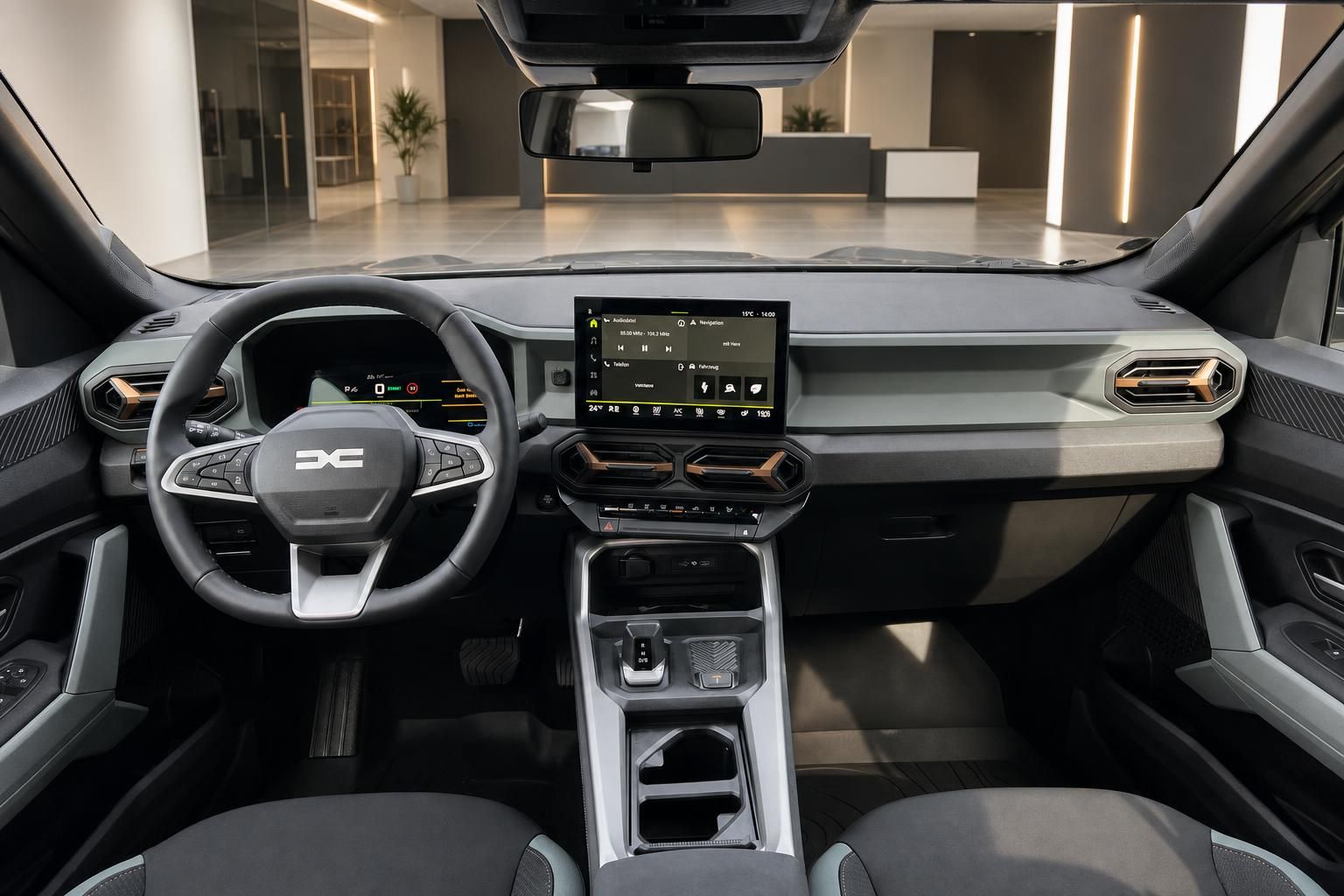 Modernes Fahrzeug-Cockpit mit digitalem Display, Lenkrad und Mittelkonsole in grauer Ausstattung