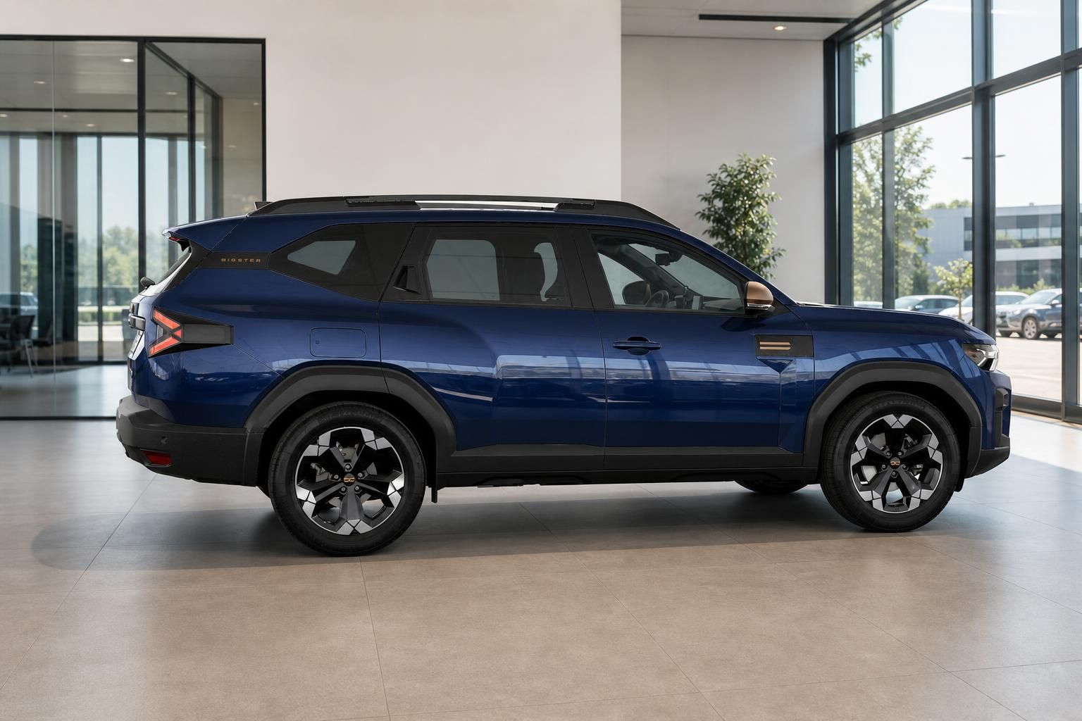 Dacia Bigster in Blau, Seitenansicht im Showroom