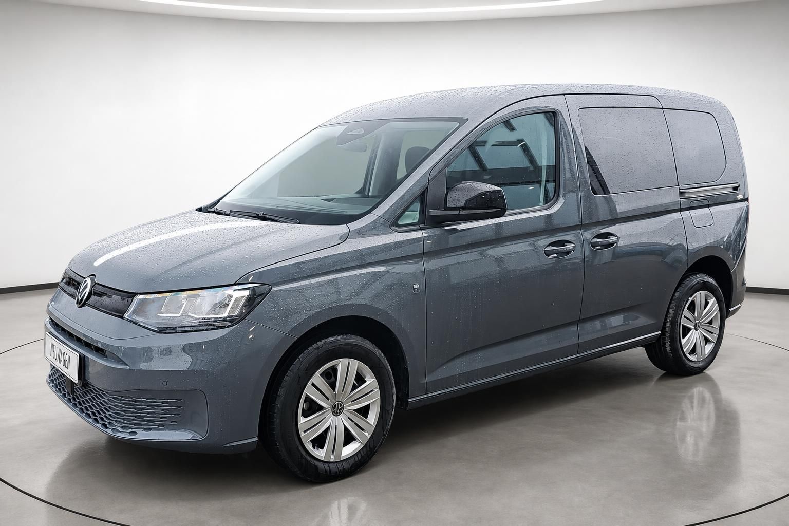 VW Caddy grau metallic Seitenansicht Neuwagen im Studio