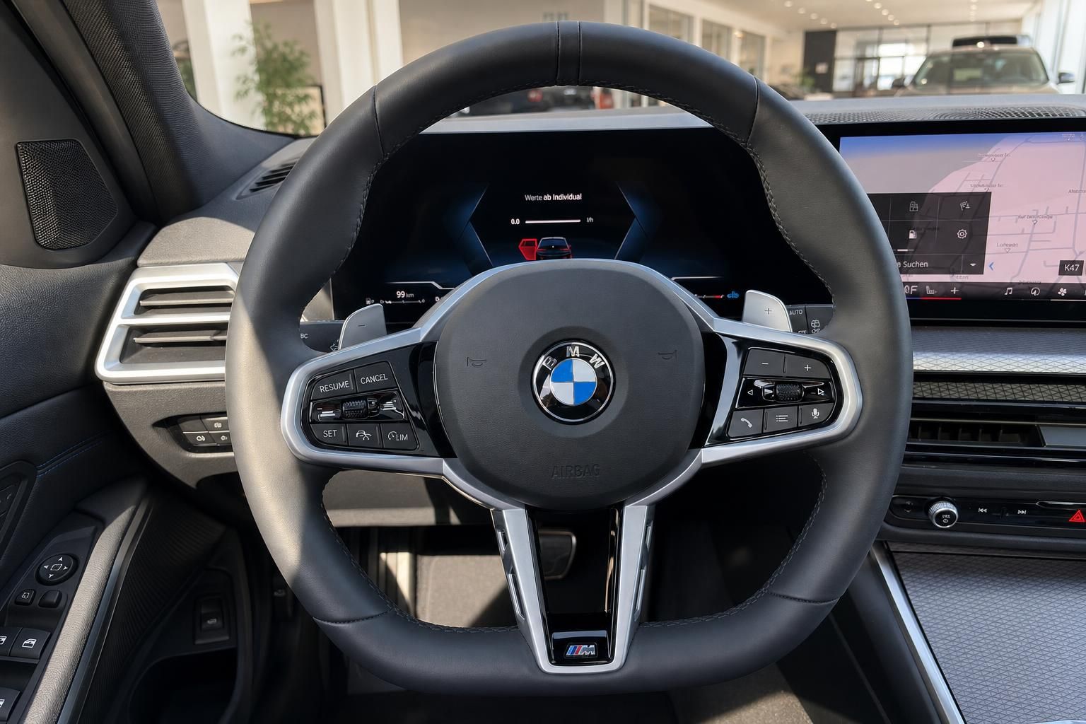 BMW 3er Touring Lenkrad Nahaufnahme mit Bedienelementen und Display
