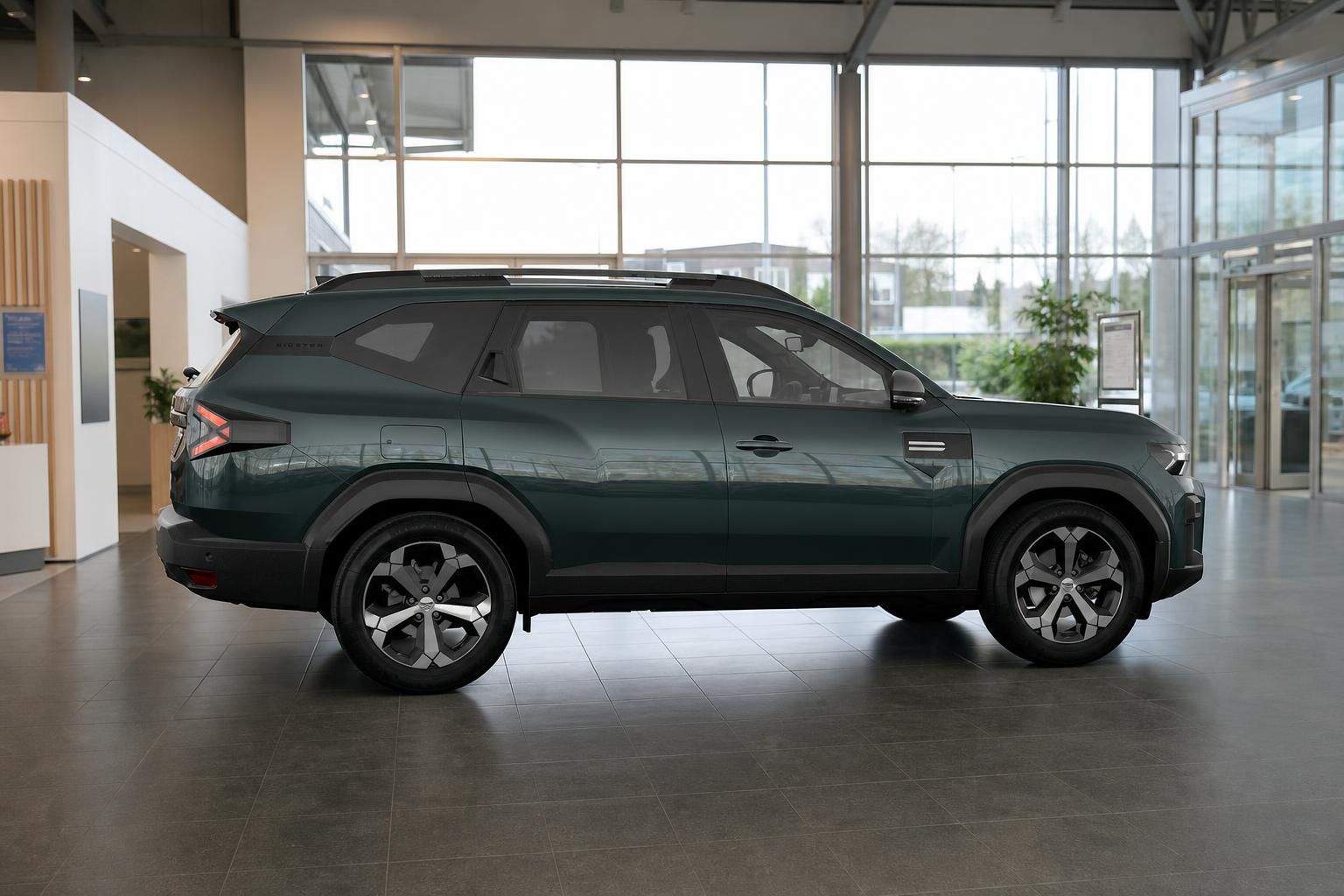 Dacia Bigster Seitenansicht in Gruen bei Tageslicht im Showroom