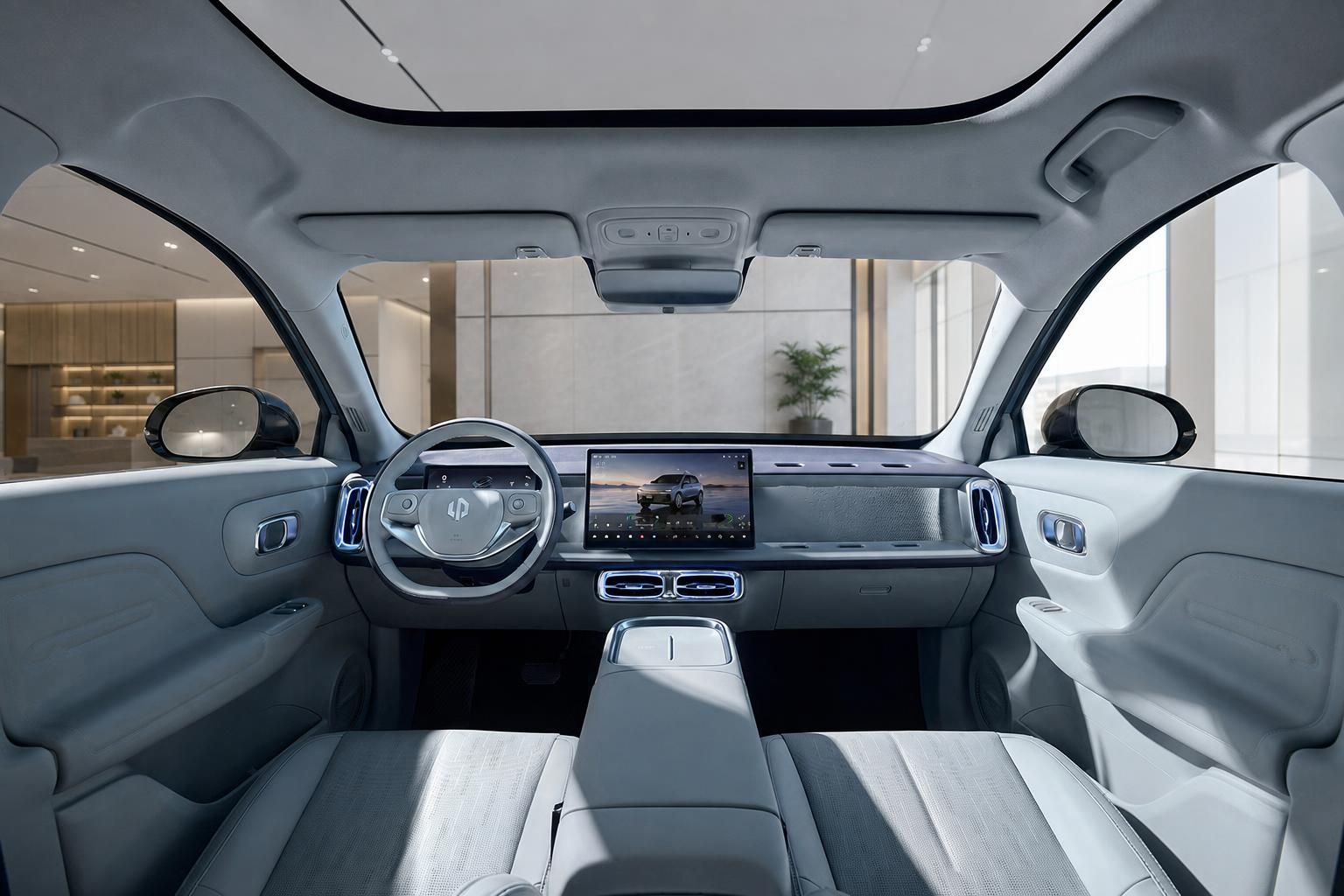 Fahrzeuginnenraum mit Cockpit, Lenkrad und großem Touchscreen