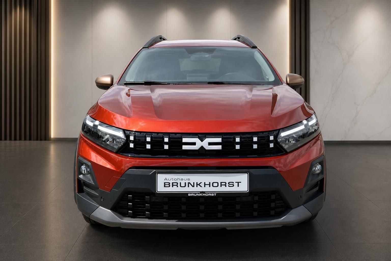 Dacia Jogger Frontansicht in Rot - Vorderseite mit LED-Scheinwerfern und schwarzem Kühlergrill