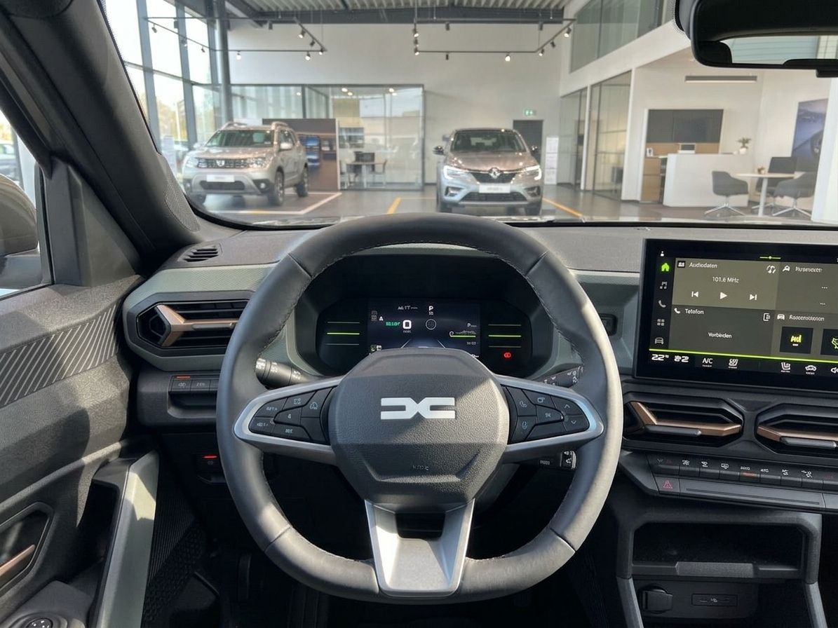 Dacia Fahrzeug Armaturenbrett mit digitalen Anzeigen und Lenkrad