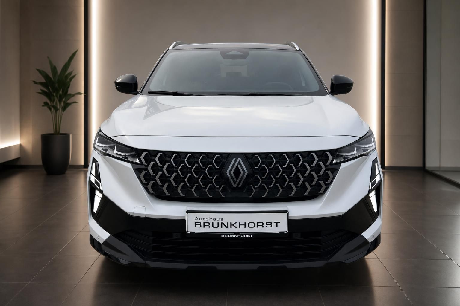Renault Austral Frontansicht weiß mit charakteristischem Kühlergrill