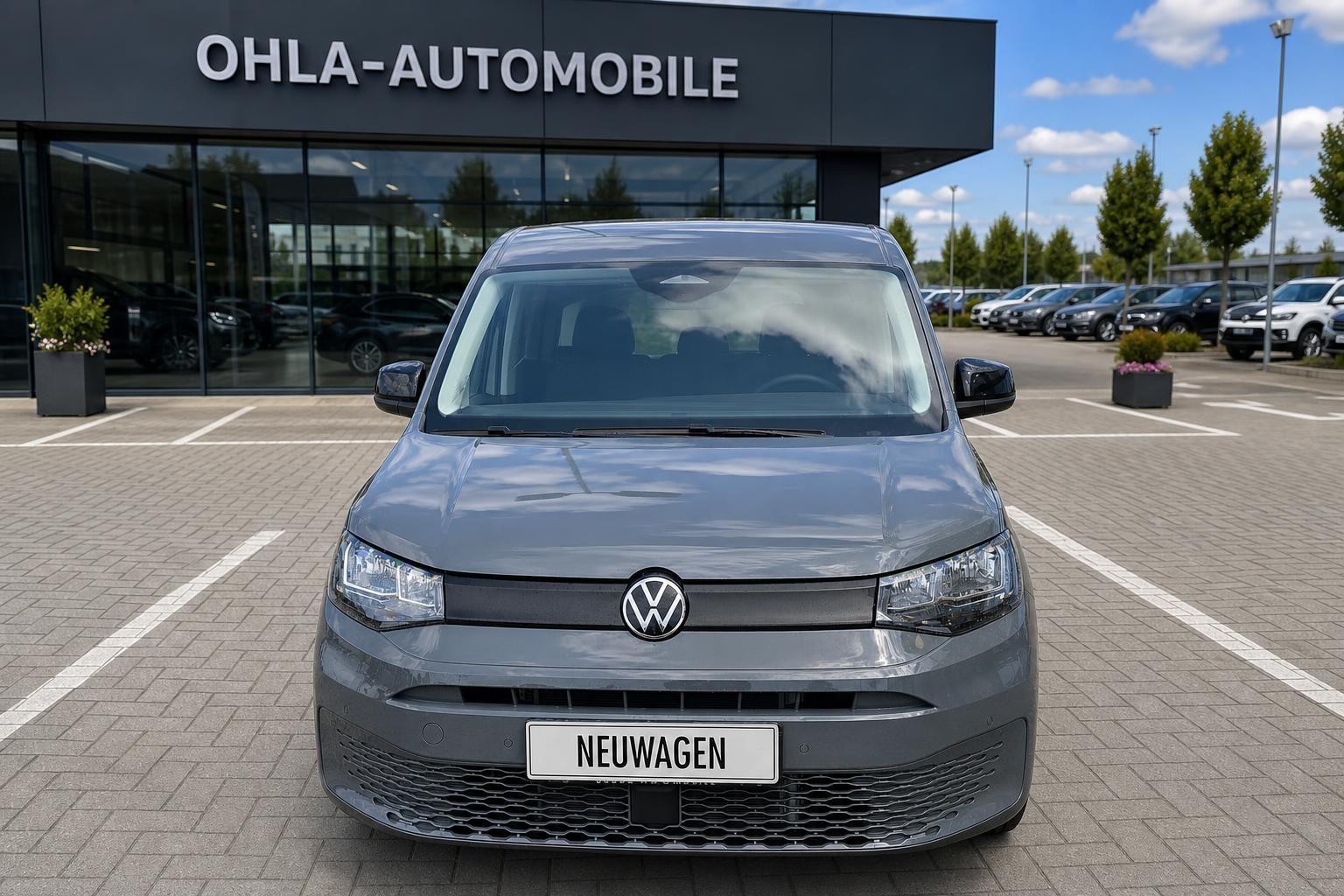VW Caddy grau Frontansicht mit Kennzeichen Neuwagen