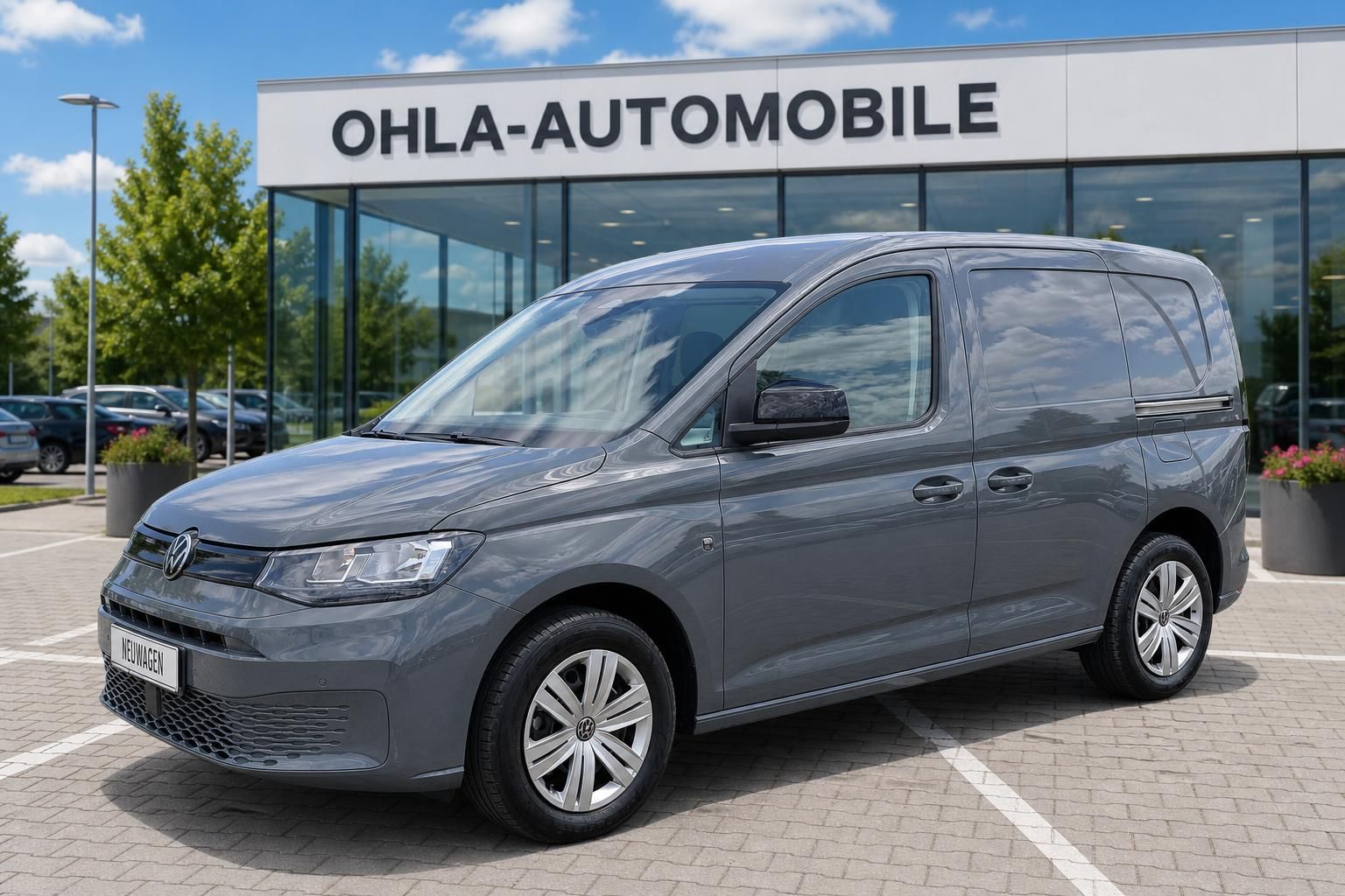 VW Caddy grau Seitenansicht vorne beim Autohaus Ohla-Automobile