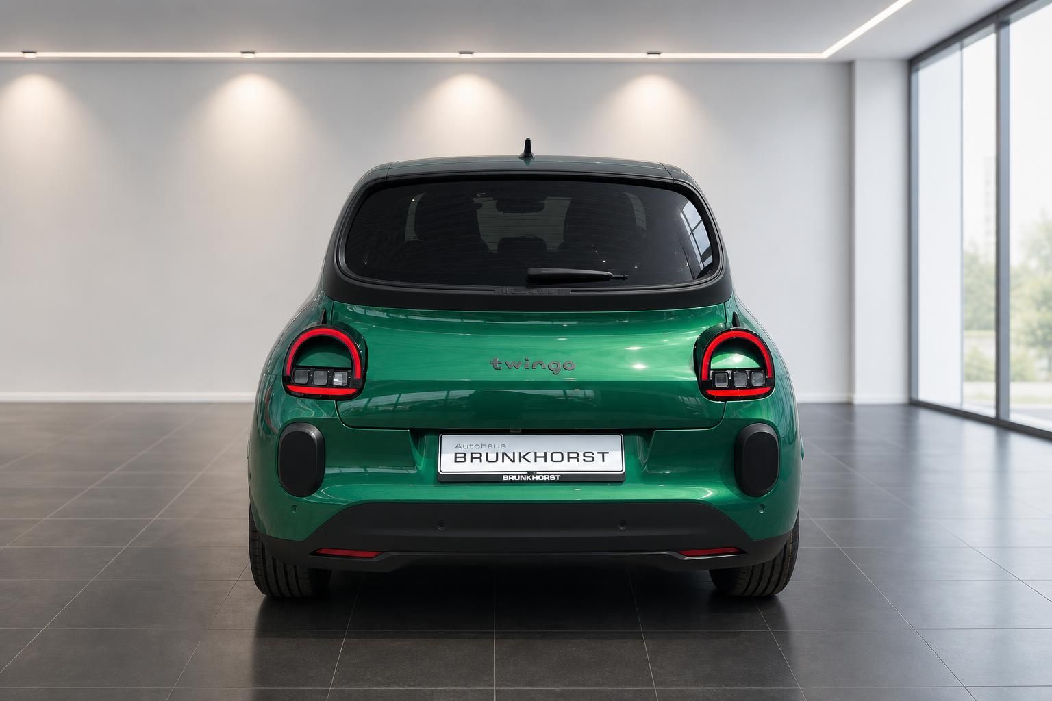 Grüner Renault Twingo Heckansicht mit charakteristischen runden Rückleuchten und Brunkhorst Kennzeichen