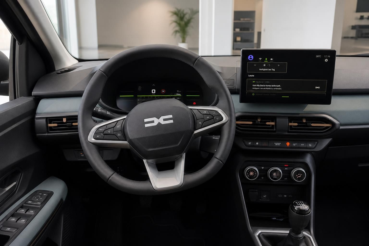 Dacia Cockpit mit Lenkrad, digitalem Tacho, Infotainment-Display und Schaltgetriebe im Autohaus