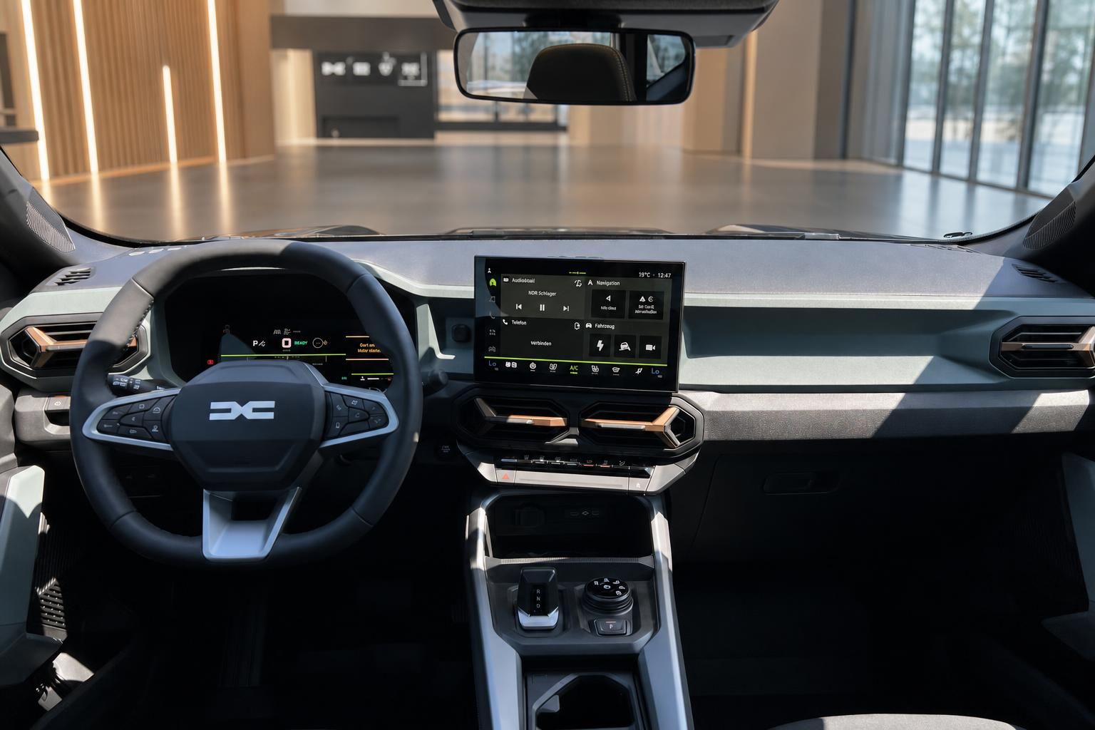 Dacia Bigster Cockpit mit Lenkrad, Mittelkonsole und großem Touchscreen-Infotainmentsystem