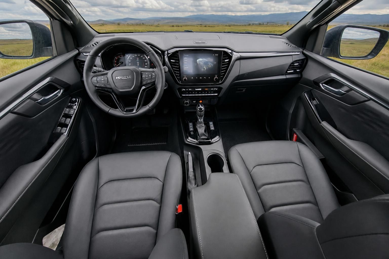 Isuzu D-Max Innenraum mit grauer Lederausstattung - Armaturenbrett, Sitze und Infotainment-System