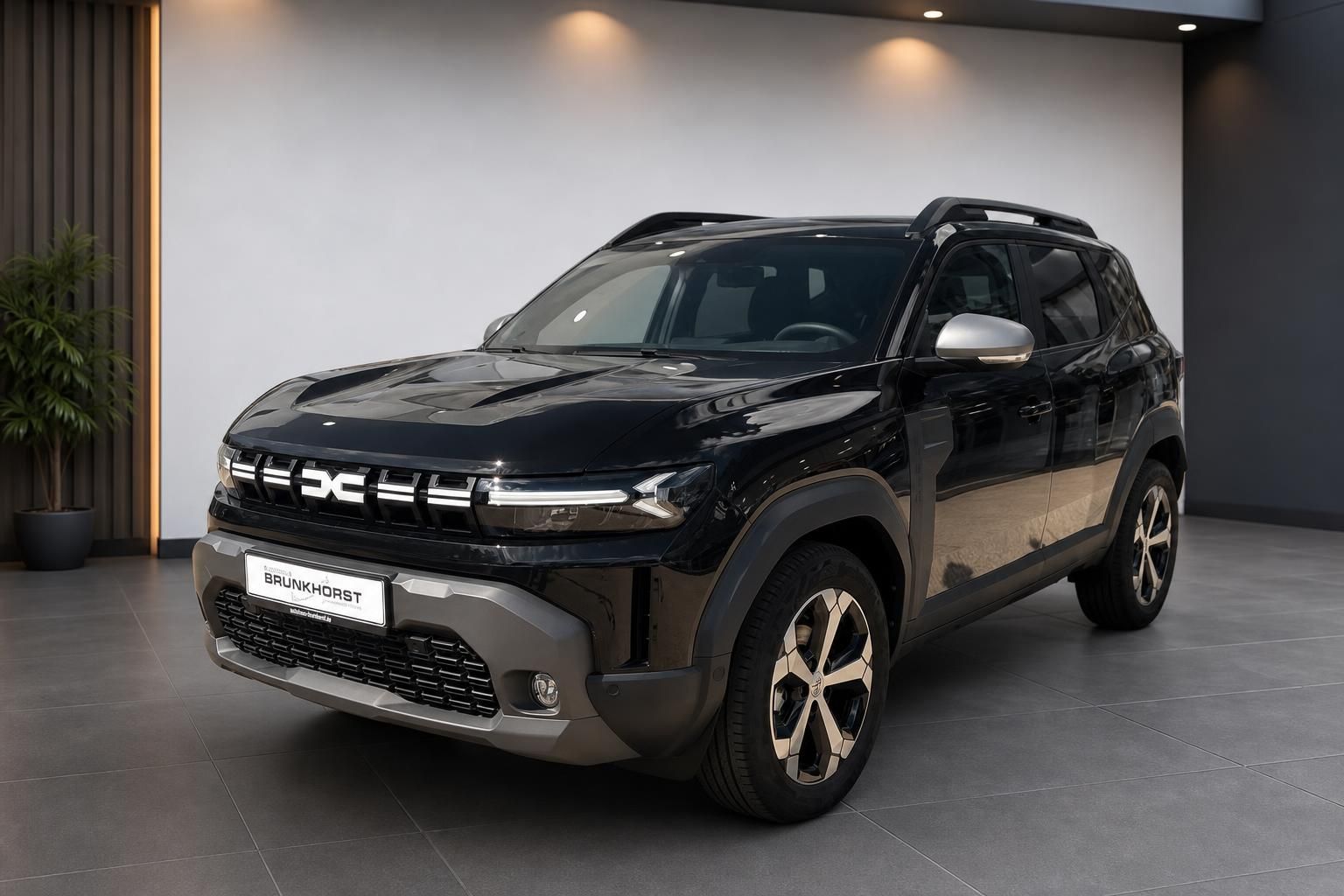 Dacia Duster SUV Seitenansicht in Dunkelblau mit silbernen Akzenten - Autohaus Brunkhorst