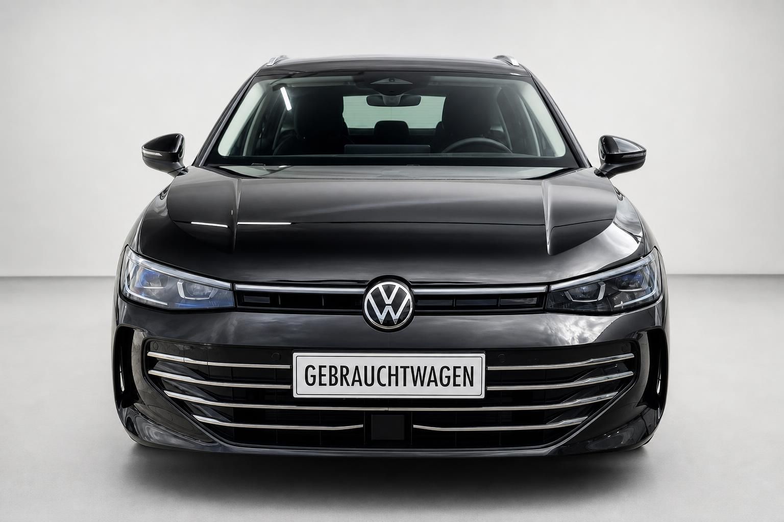 VW Passat Variant schwarz Frontansicht Kuehlergrill mit VW Logo