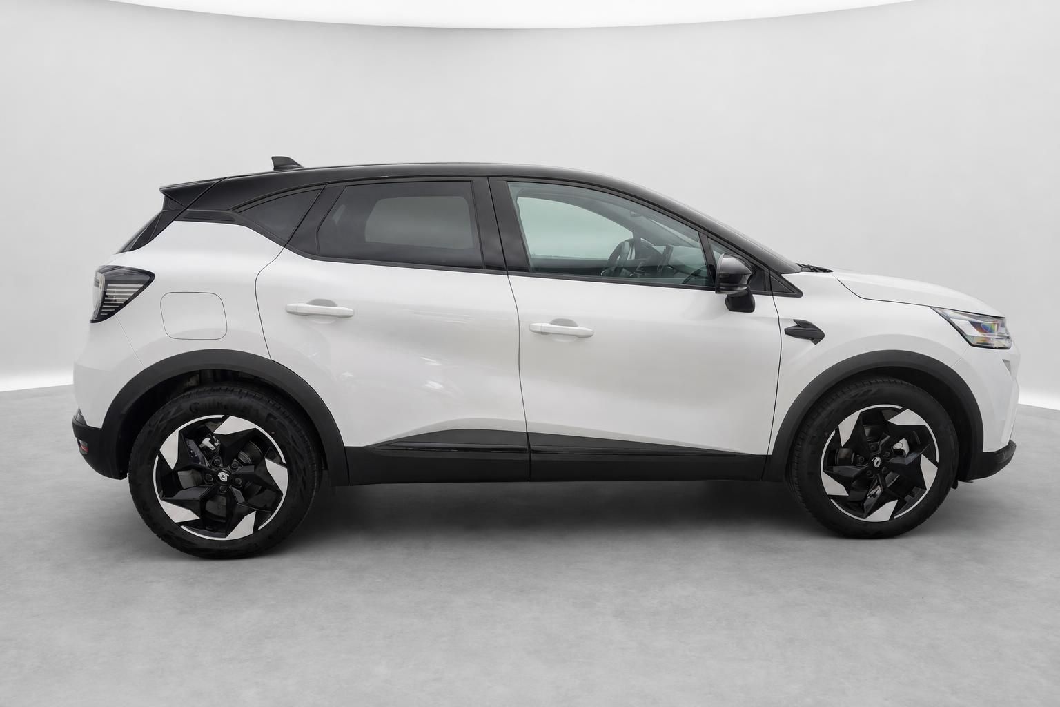Renault Captur weiß Seitenansicht mit schwarzem Dach und Leichtmetallfelgen