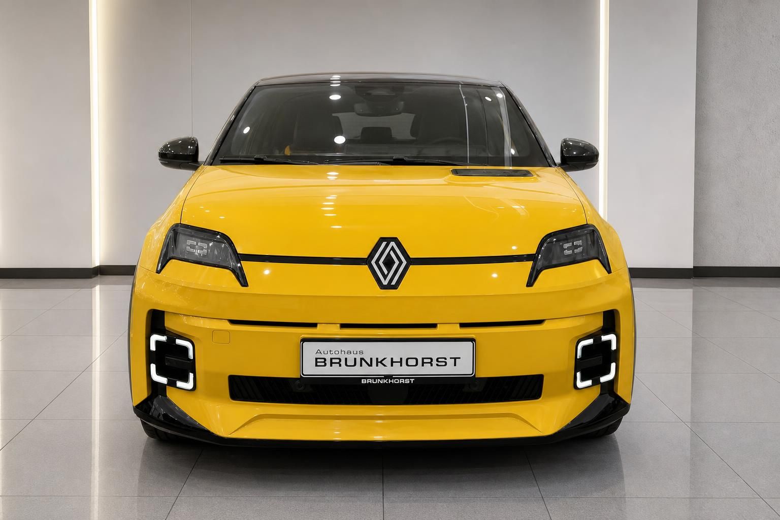Renault 5 E-Tech Electric gelb Frontansicht mit LED-Scheinwerfern bei Autohaus Brunkhorst