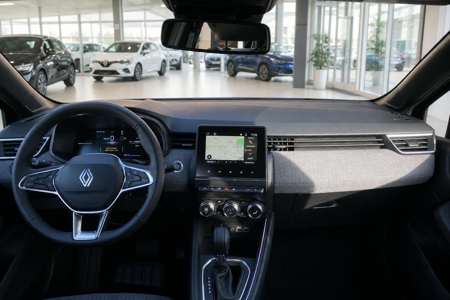 Renault Cockpit mit Lenkrad, digitalem Kombiinstrument und zentralem Touchscreen-Infotainmentsystem