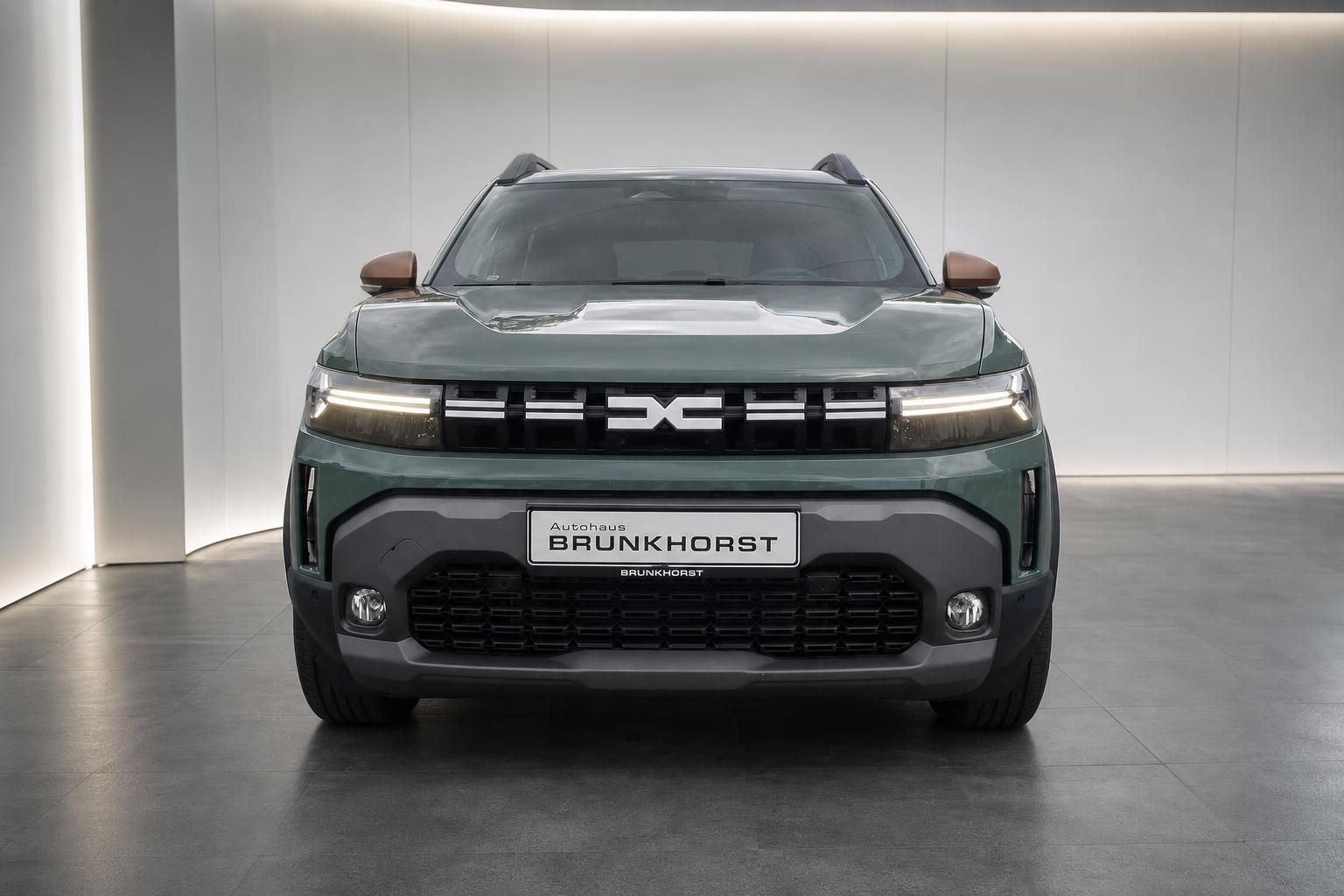Dacia Duster grün Frontansicht mit LED Scheinwerfern direkt
