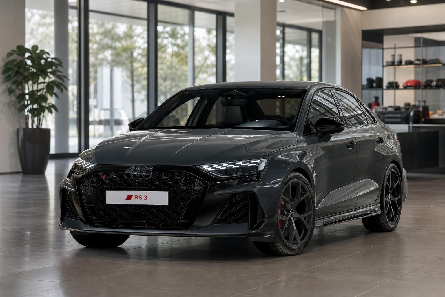 Audi RS3 Limousine grau in modernem Autohaus Showroom, Frontansicht