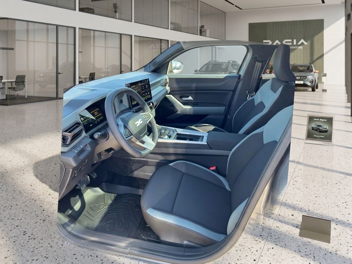 Dacia Fahrzeug Innenraum blau-graue Sitze - modernes Cockpit mit Touchscreen und Lenkrad