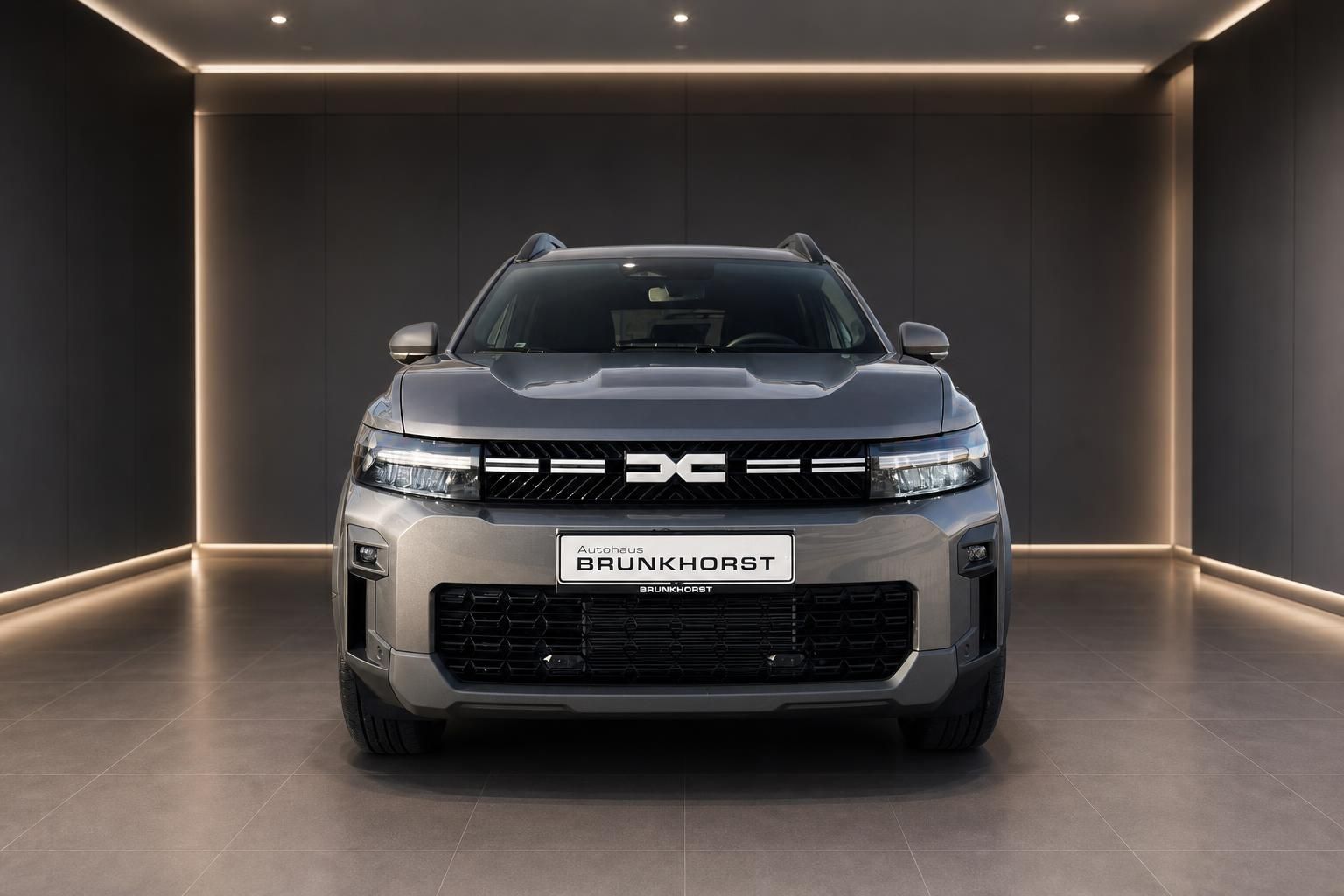 Dacia Bigster Frontansicht in grau - moderner SUV mit LED-Scheinwerfern