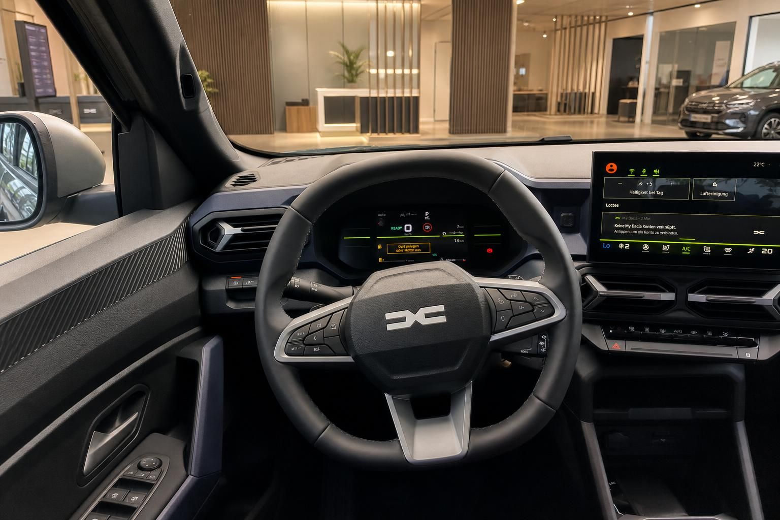 Dacia Innenraum Cockpit mit Lenkrad, Digitalinstrumente und Infotainment-Touchscreen