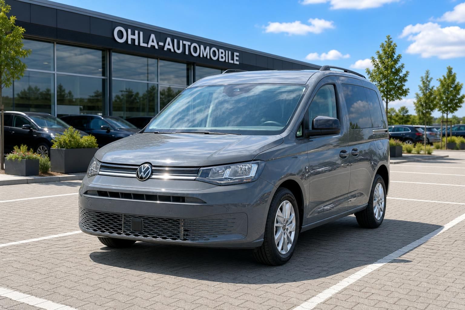 VW Caddy grau Frontansicht auf Parkplatz Autohaus OHLA